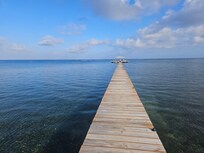 View down pier after blue door.