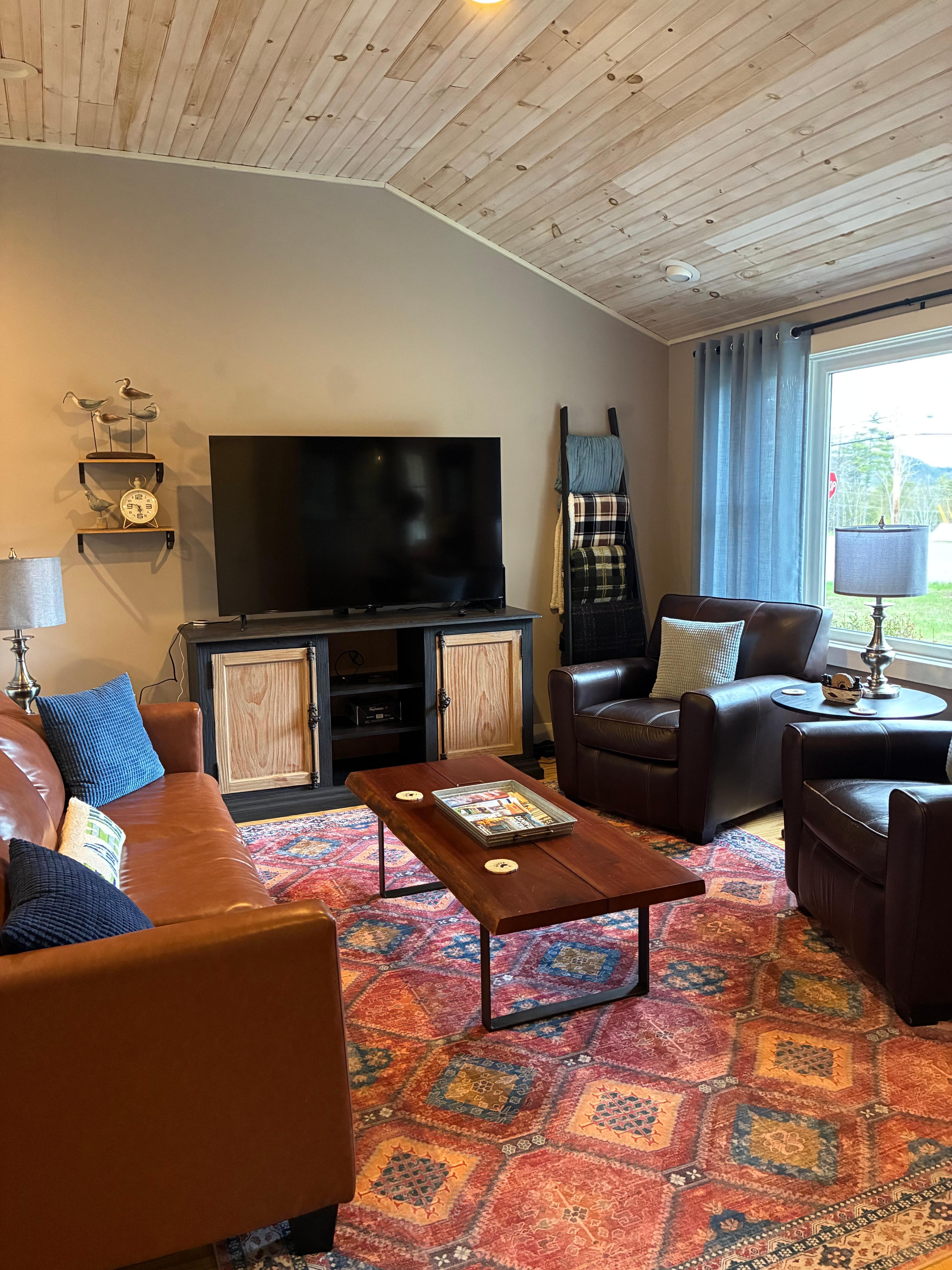 Cozy and spacious living room. Puzzles and games are in this area.