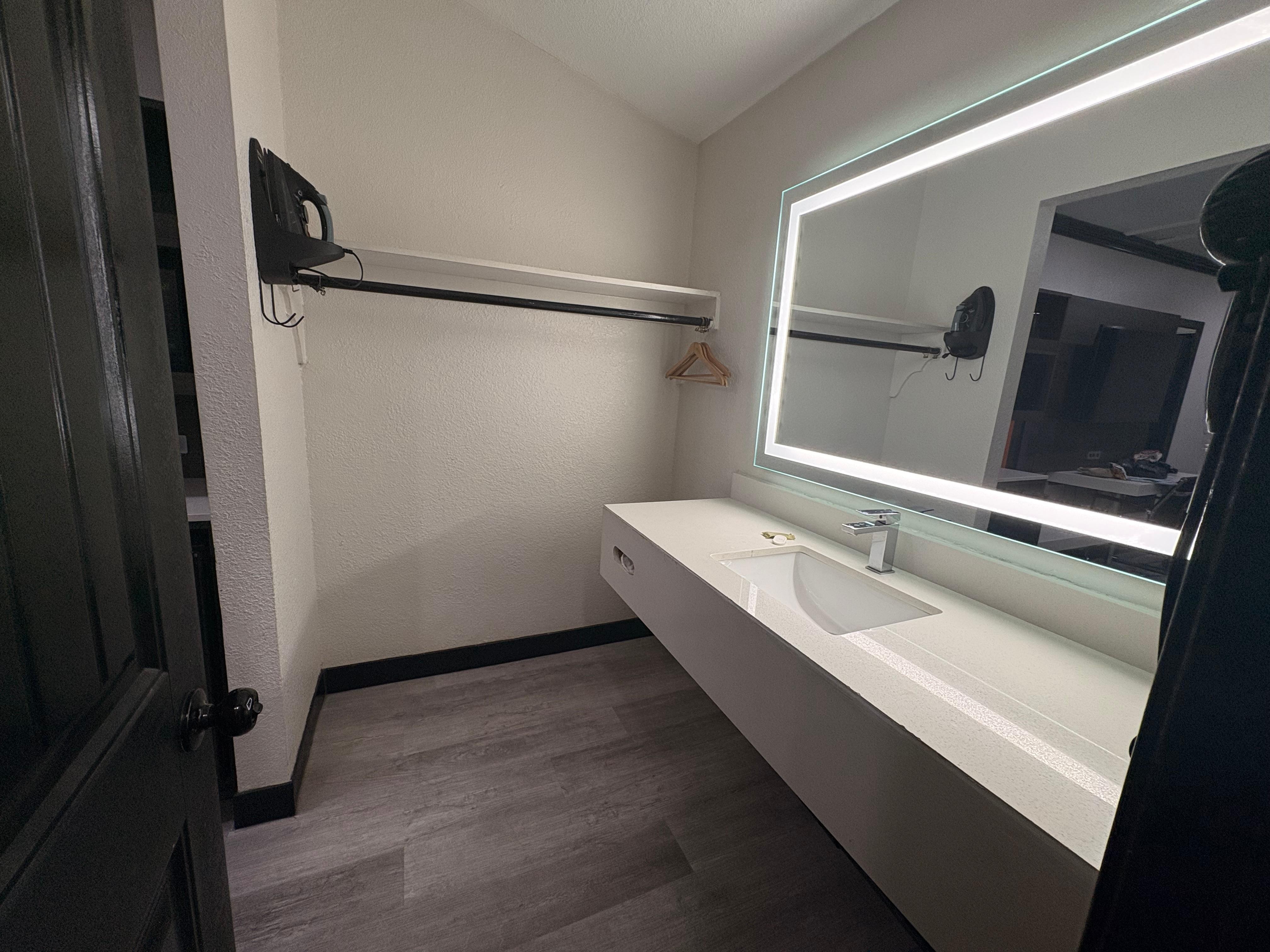 Really nice vanity mirror, plenty of counter space. They provided hand soap, lotion, Kleenex, hair dryer, iron.
