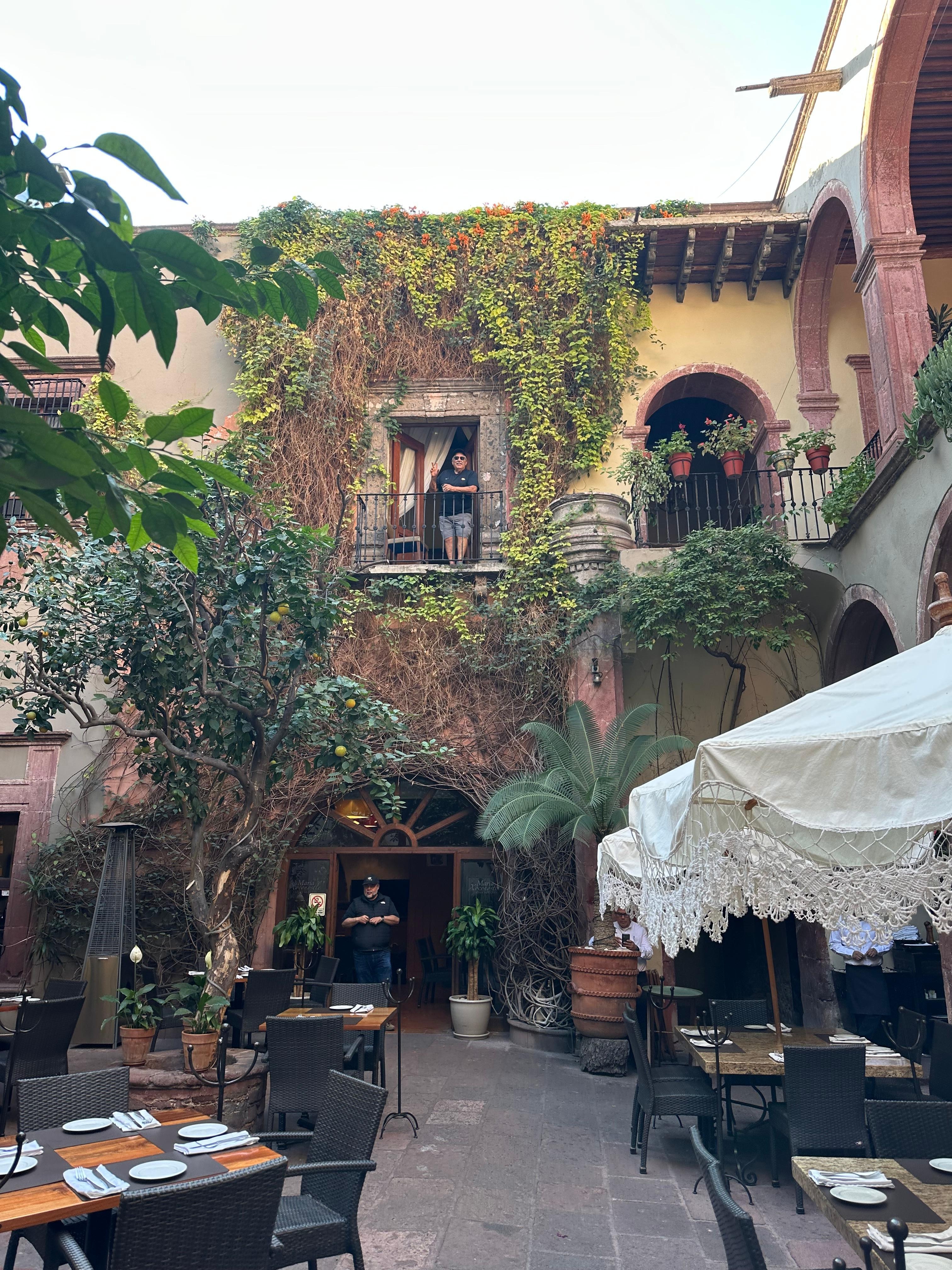 Hubby on the balcony, view of courtyard 