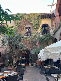 Hubby on the balcony, view of courtyard