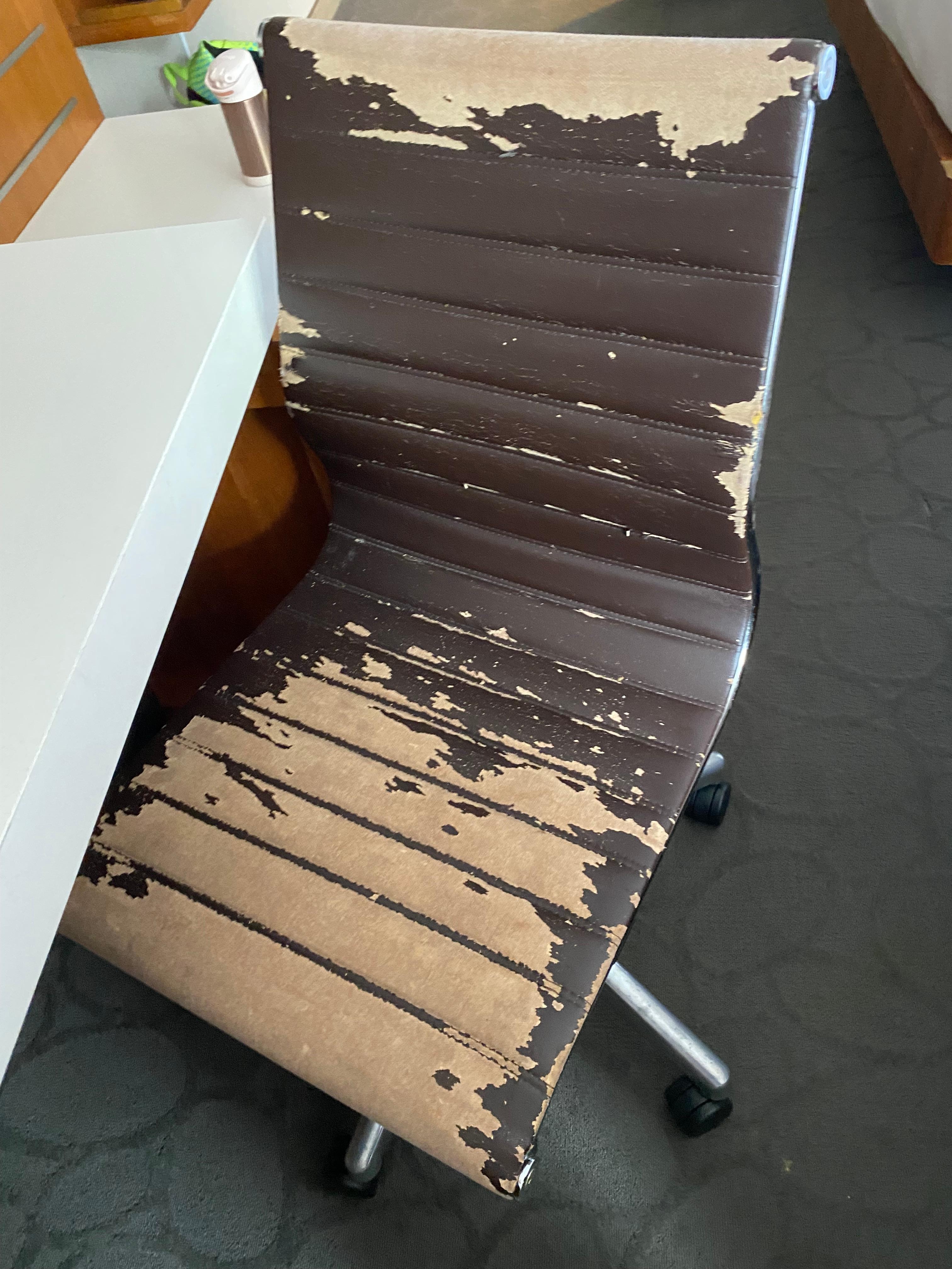 Shredded office chair in room