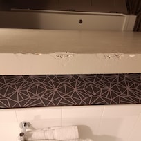 They tried to patch the crack, holes, damage, etc. but did a terrible job. The door needs to be replaced.