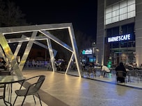 Square next to the hotel with coffee shops and restaurants