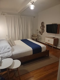 Simple king size bedroom on the bottom floor.