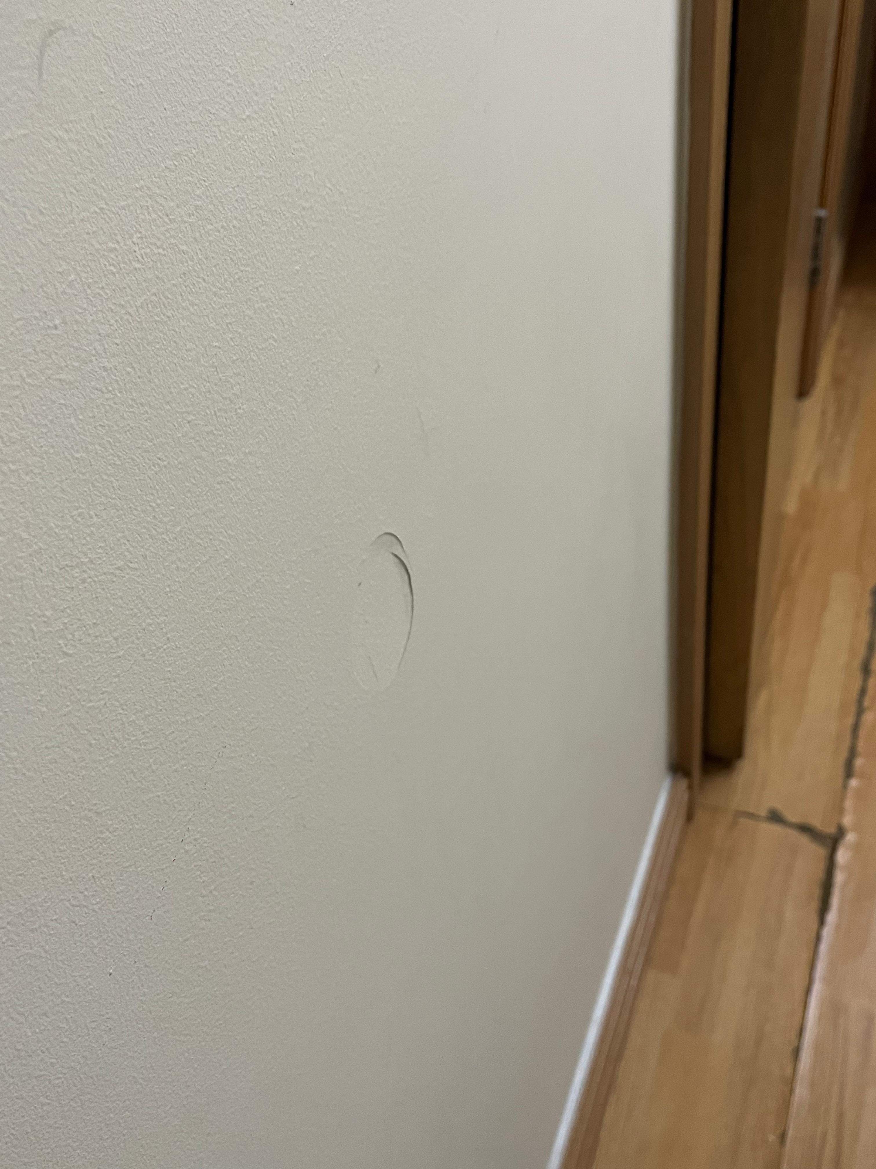 Room wall next to bathroom entrance 