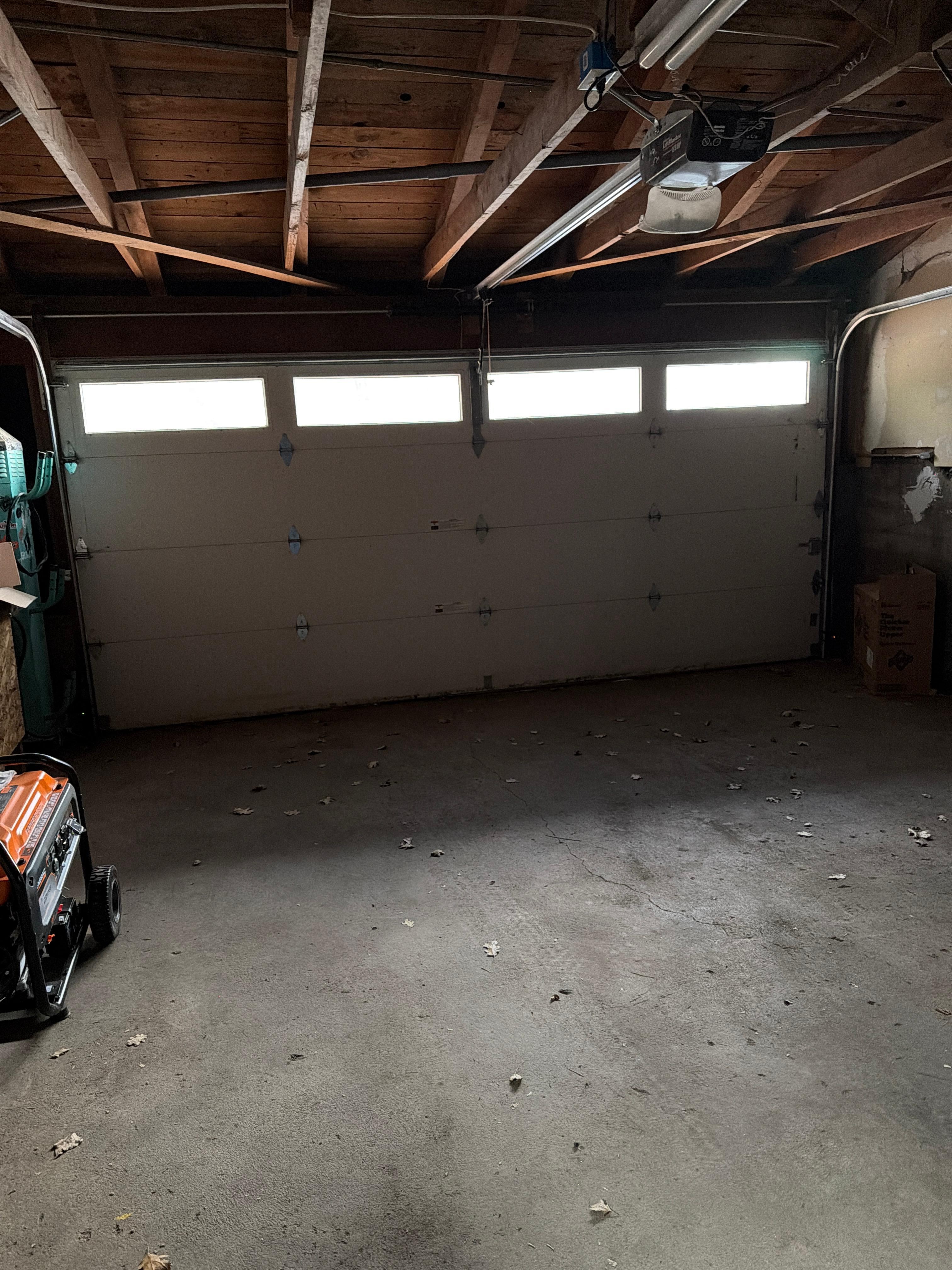 Listed as 2 car garage-maybe if you had 2 Mini Coopers they would fit.