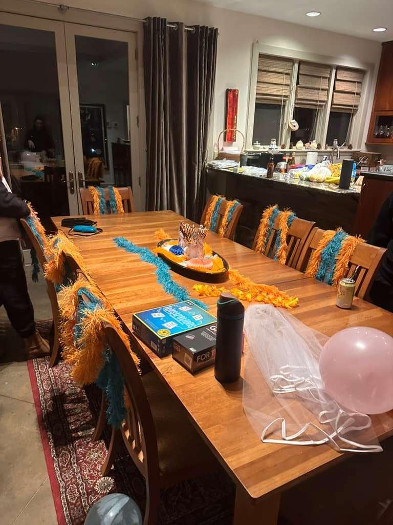 Upstairs dining table (kitchen behind)