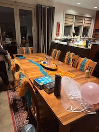 Upstairs dining table (kitchen behind)