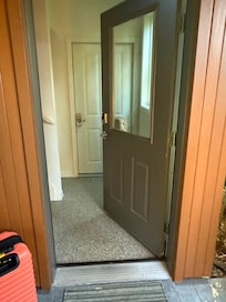 White door beyond is a mystery door.
To the left is an open storage area.