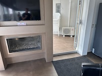 Non functional fireplace, damaged weatherstripping on all doors.