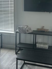 Dirty bedding in living room.