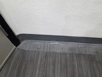 Garbage behind the bathroom door