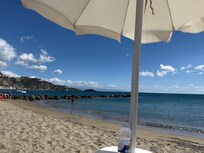 Beach with chairs and umbrellas right down the street