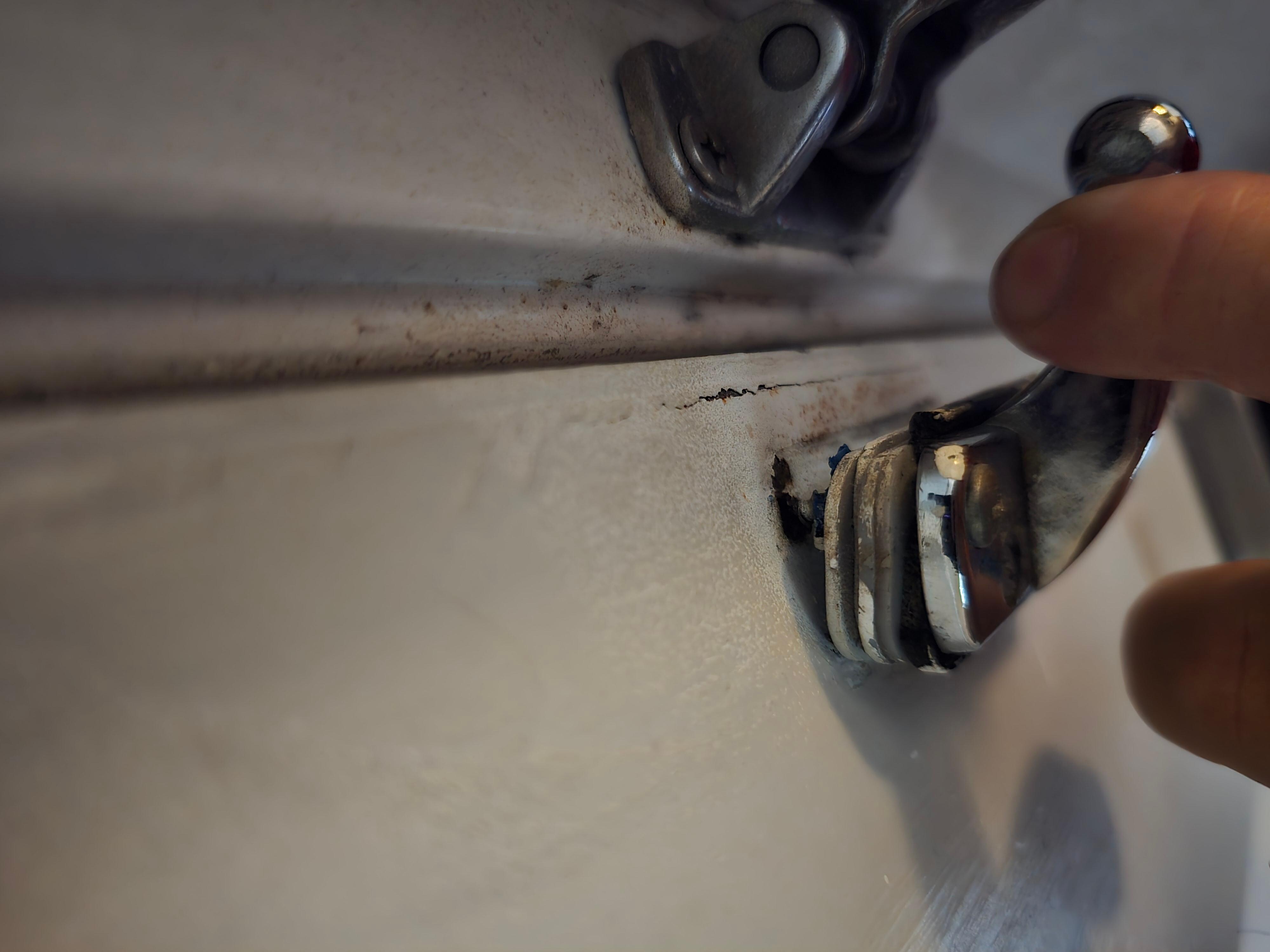 Door bolt loose and missing screws