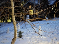 Building snowman outside the front door