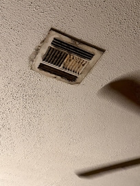 Vent in bedroom over bed.