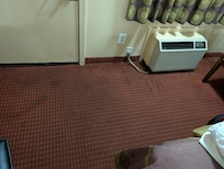 Stained and musty smelling carpet. Don't motel's need to meet some minimum standard?