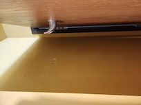 Holes from bathroom door