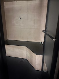 Broken shower with a door that doesn’t close