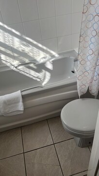 Bathroom - a little problem the shower curtain hits the light fitting so you have to push the plastic ringlets past the light fitting if you want to close it trouble if your not very talll