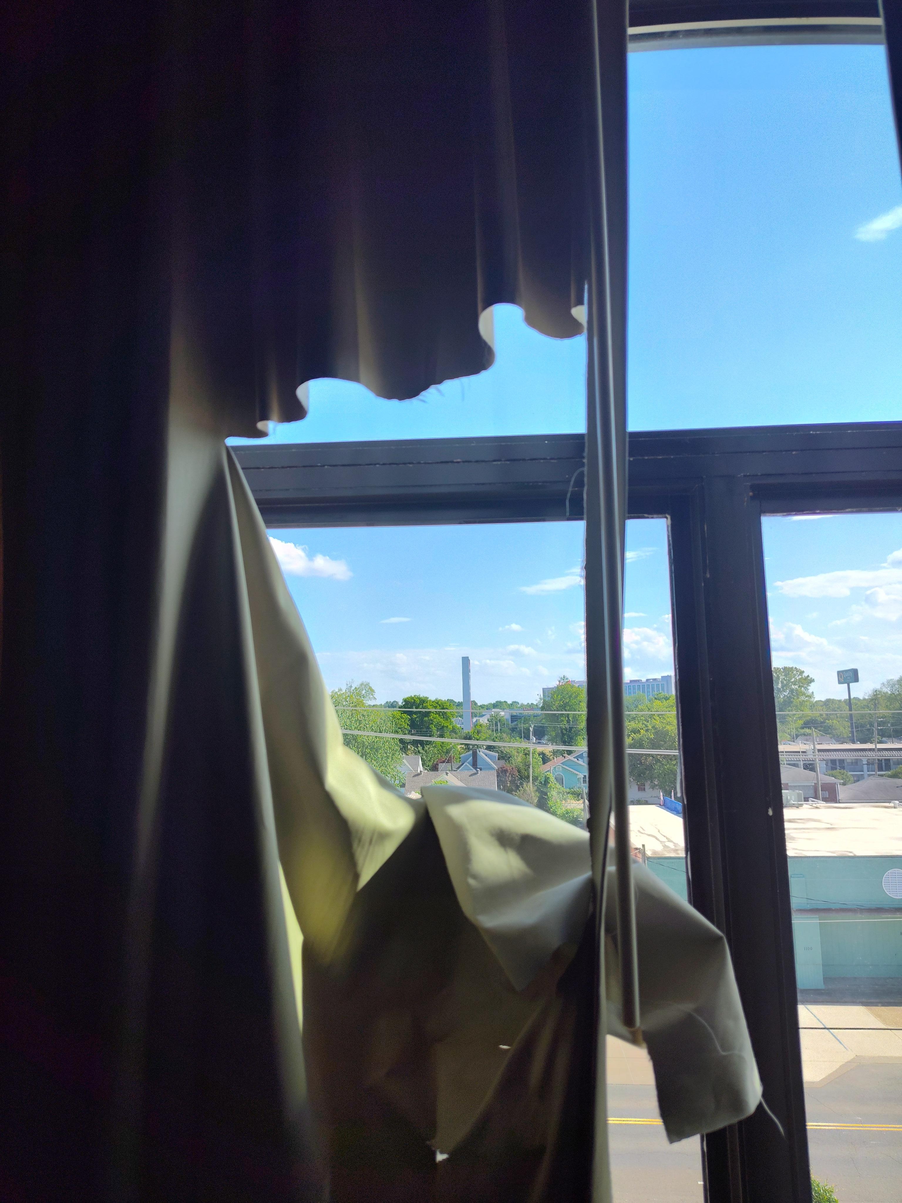 Torn and sagging room curtain at the Wingate by Wyndham Bossier City, LA.