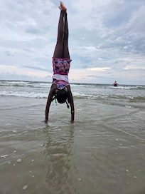My daughter enjoyed swimming and doing hand stands at the beach.