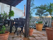 The rooftop terrace has seating for six and is a great location for morning coffee.