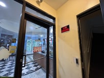 The entrance is next to the Ben and Jerry ice cream store