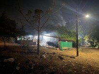 Cow patties burning all around the property at night.