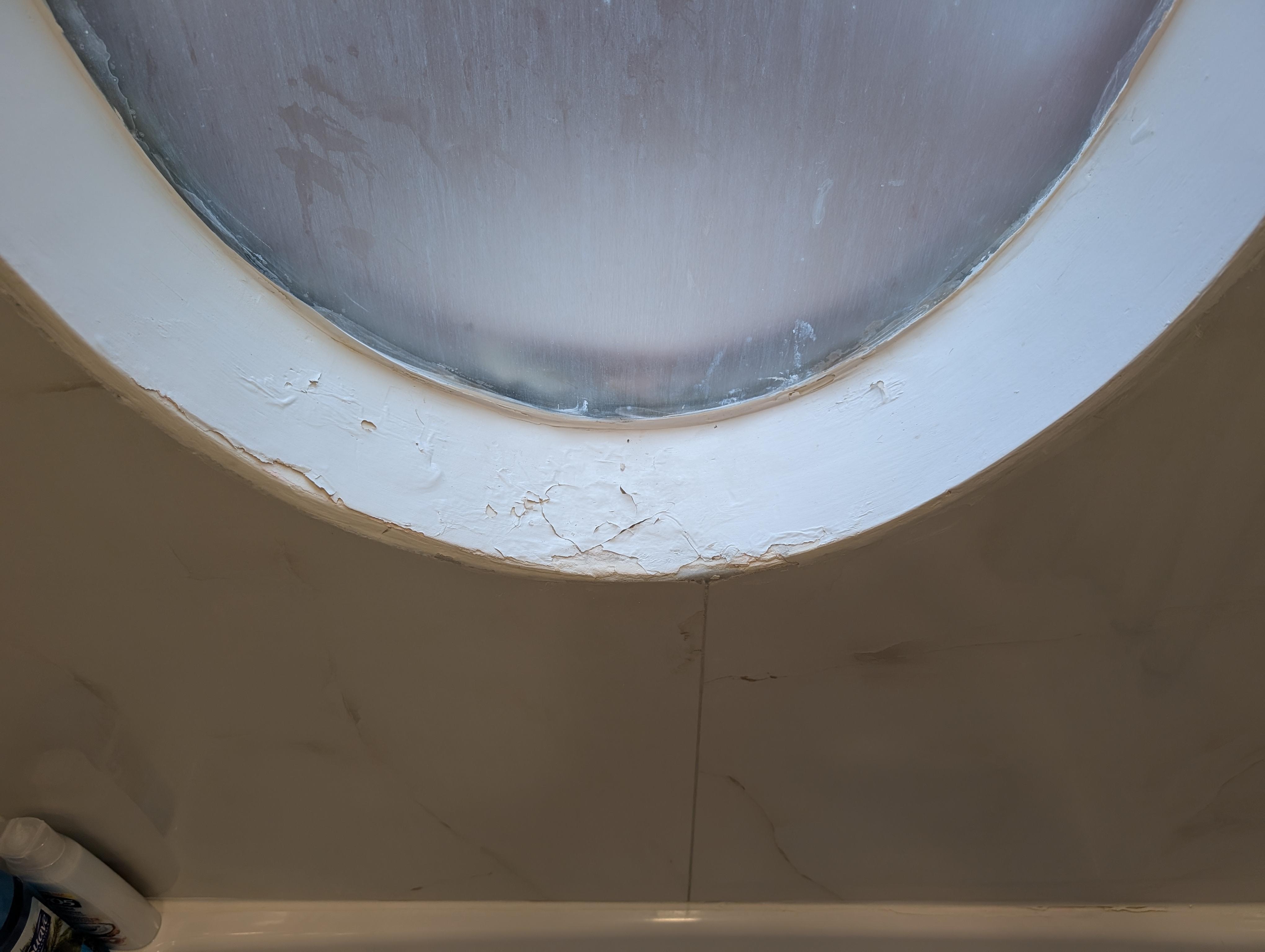 Paint peeling in the hallway bathroom shower