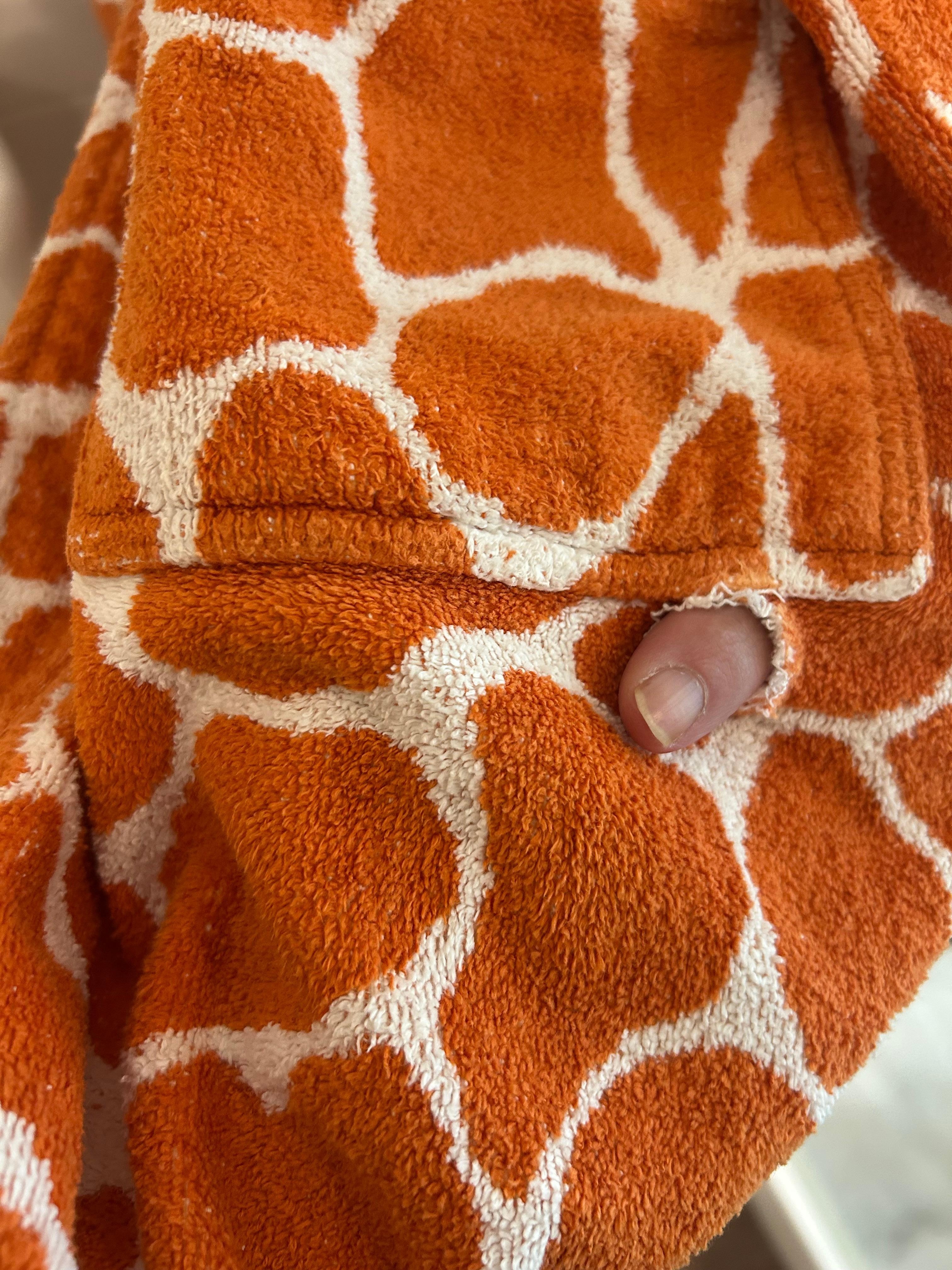 This was the hole in the robe-plus my finger through it!