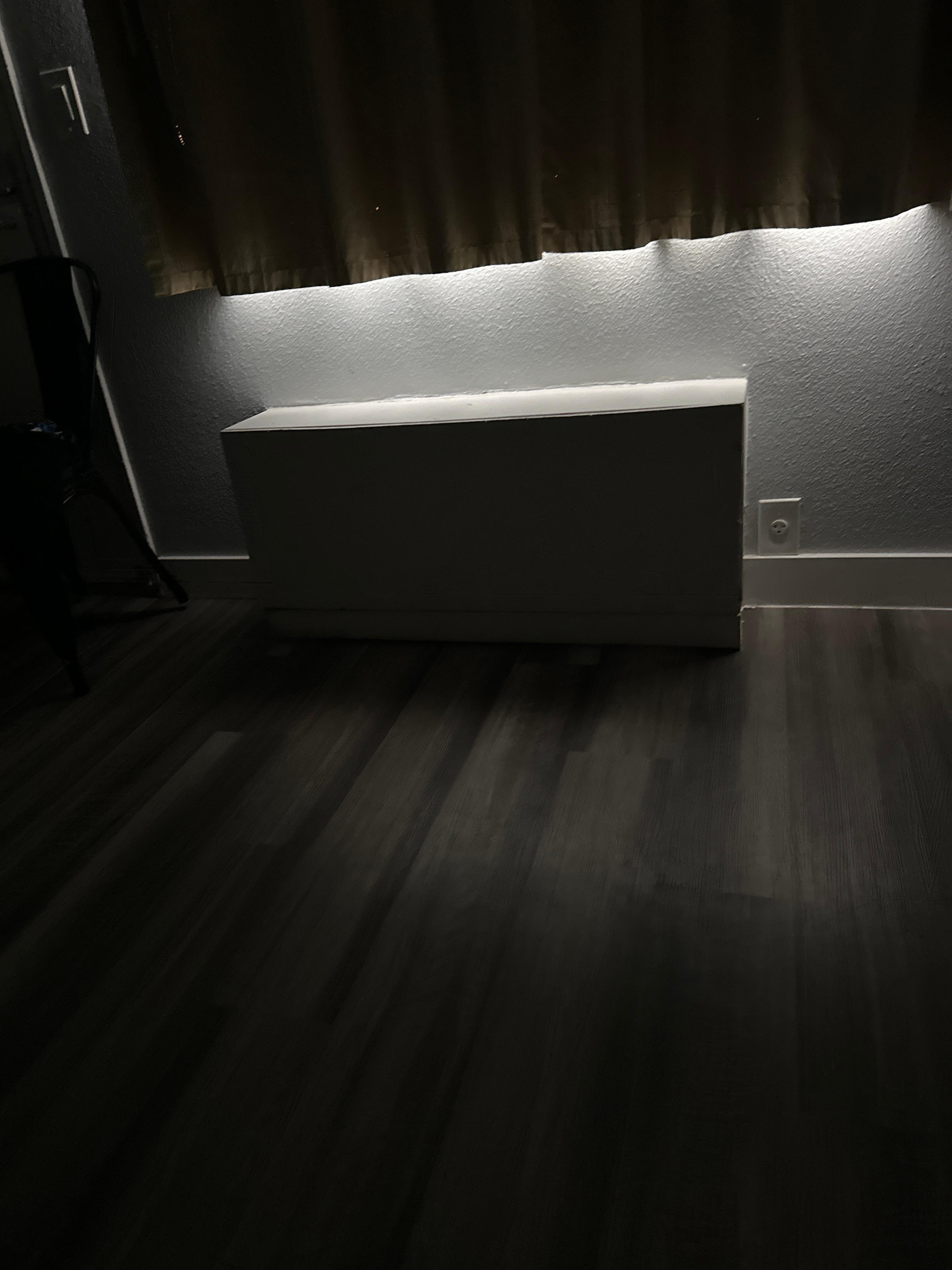 A wooden box where there should be an AC.
