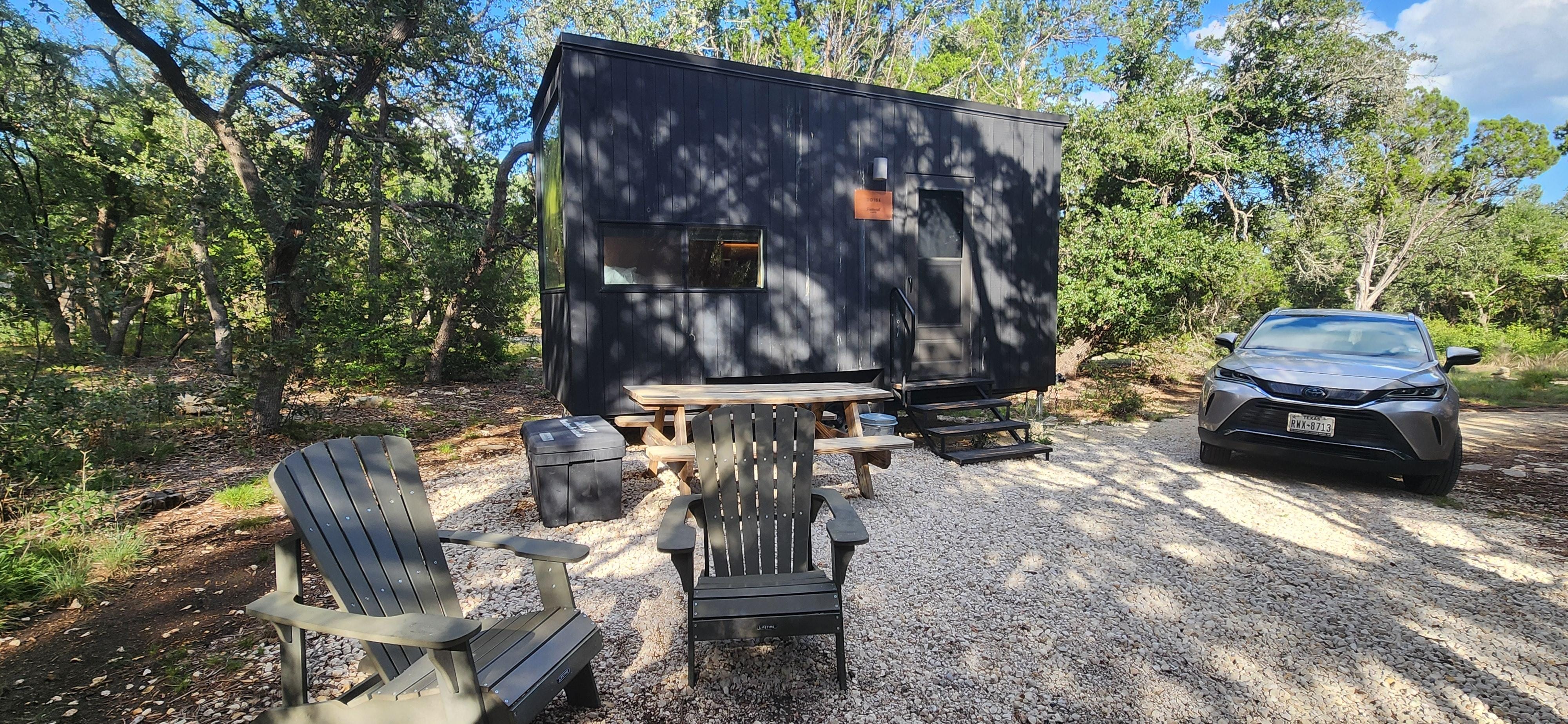 Outside with table, chairs, and firepit