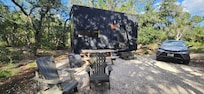 Outside with table, chairs, and firepit