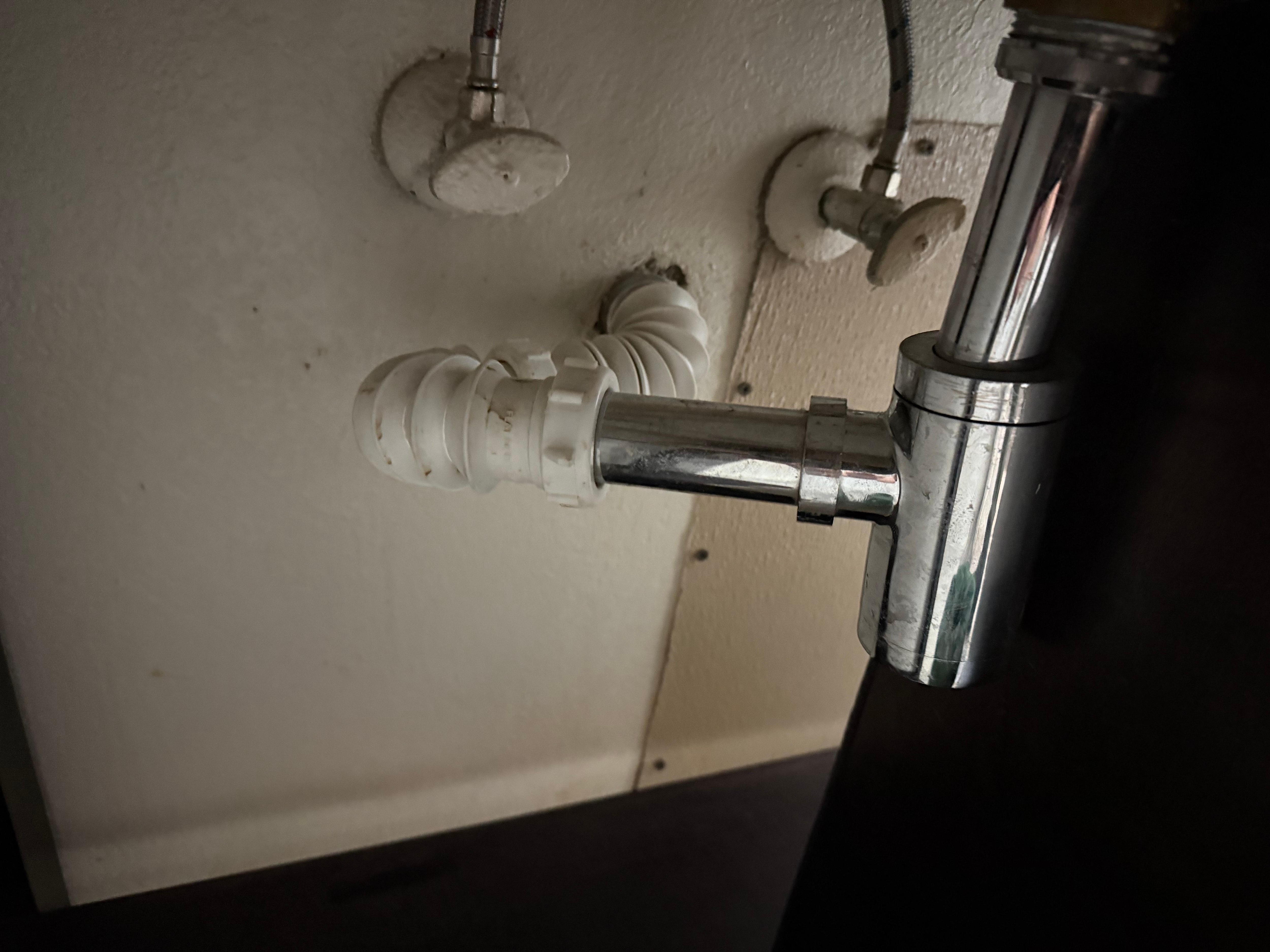 No pee trap installed on the sink means sewer gas backs up through the pipes and into the room.