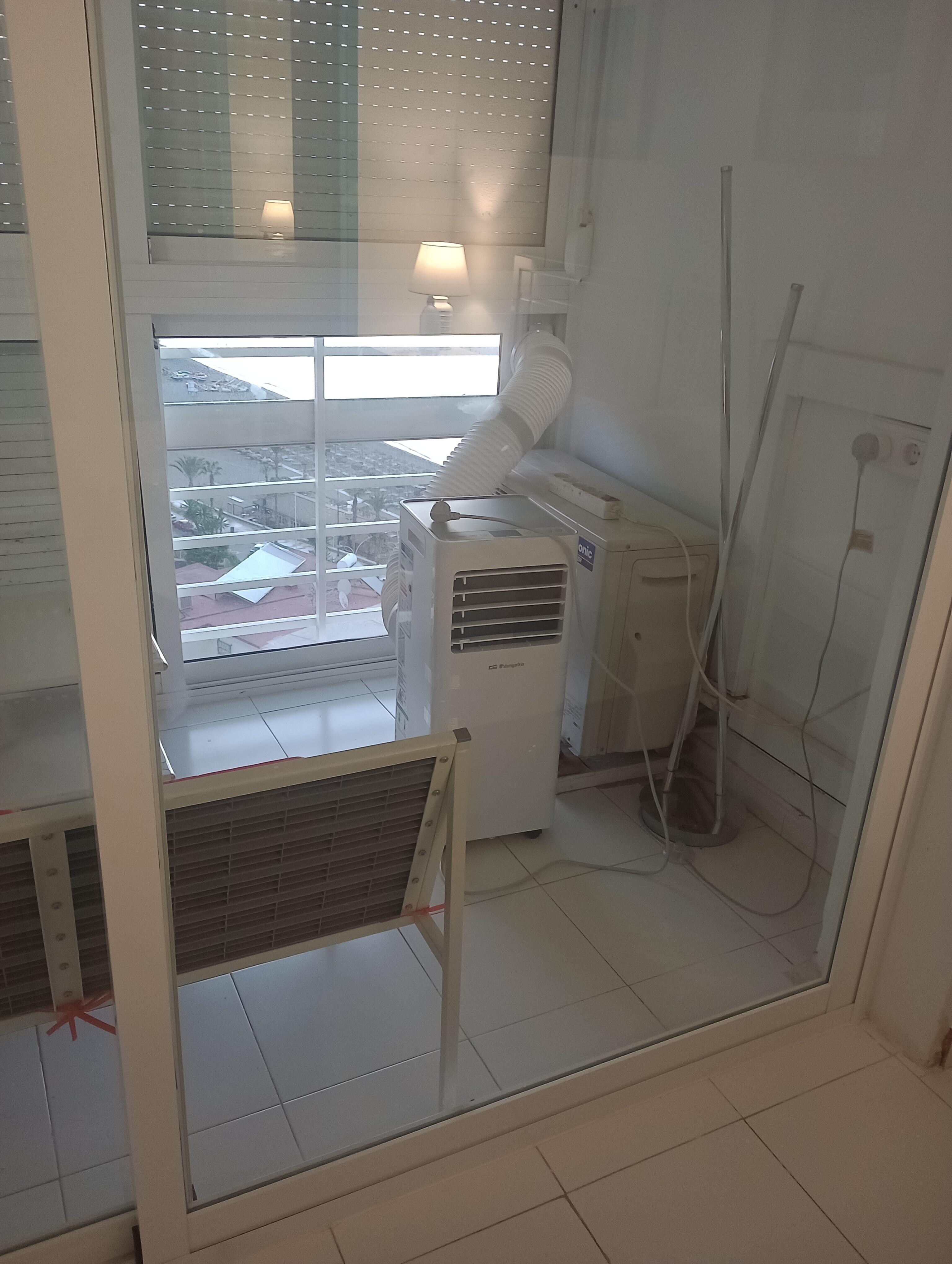 Portable air con contained to one corner of one room because it had a fixed air vent.