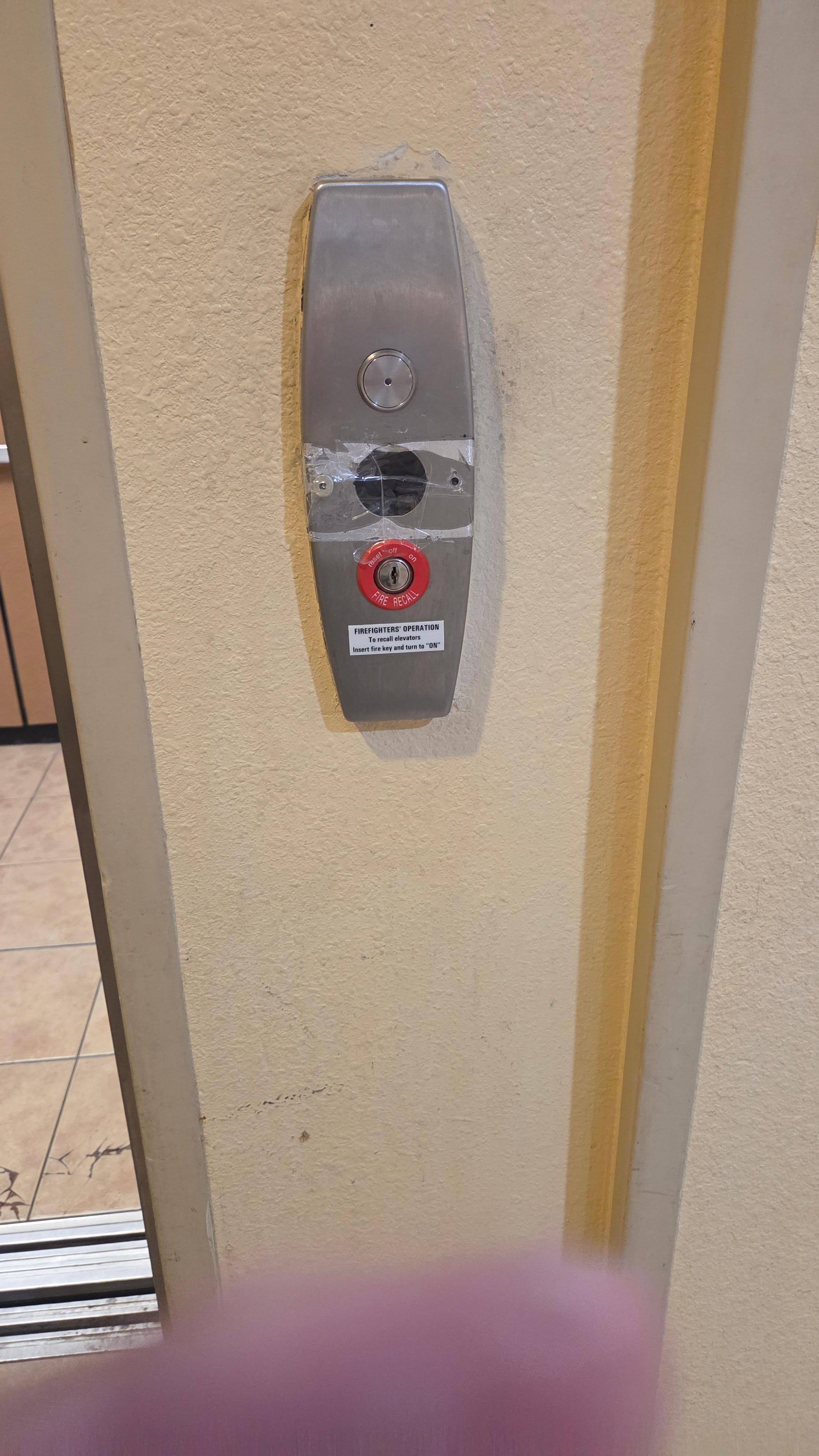 tape over button