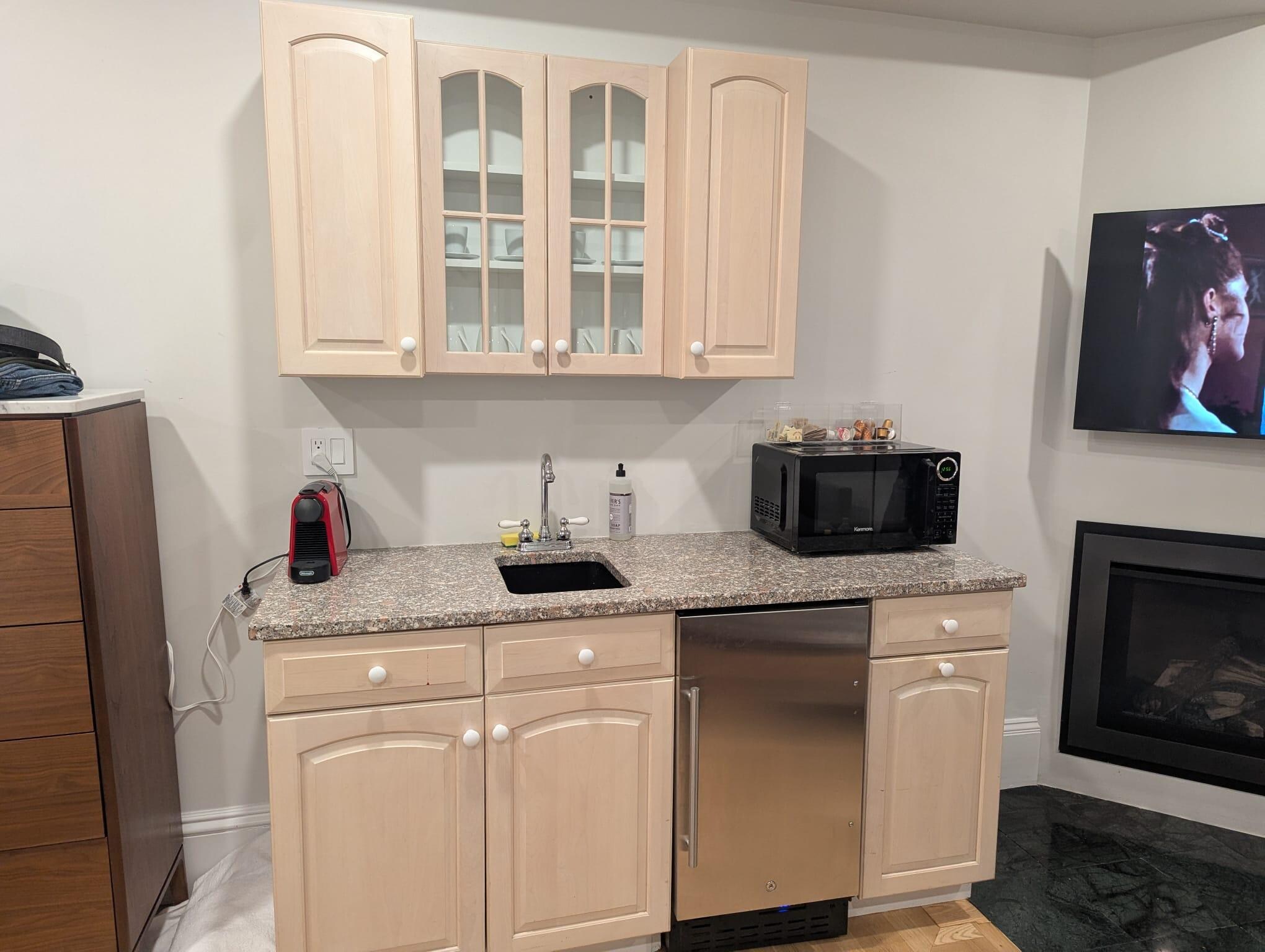 As you can see from photos, tiny refrigerator, no stove/hotplate, no dishwasher, no dining table.