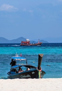Beautiful sea & not too many Longtail boats.