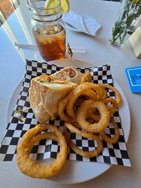 A buffalo chicken wrap with a side of onion rings and a ice tea from the hotel restaurant was delicious!!