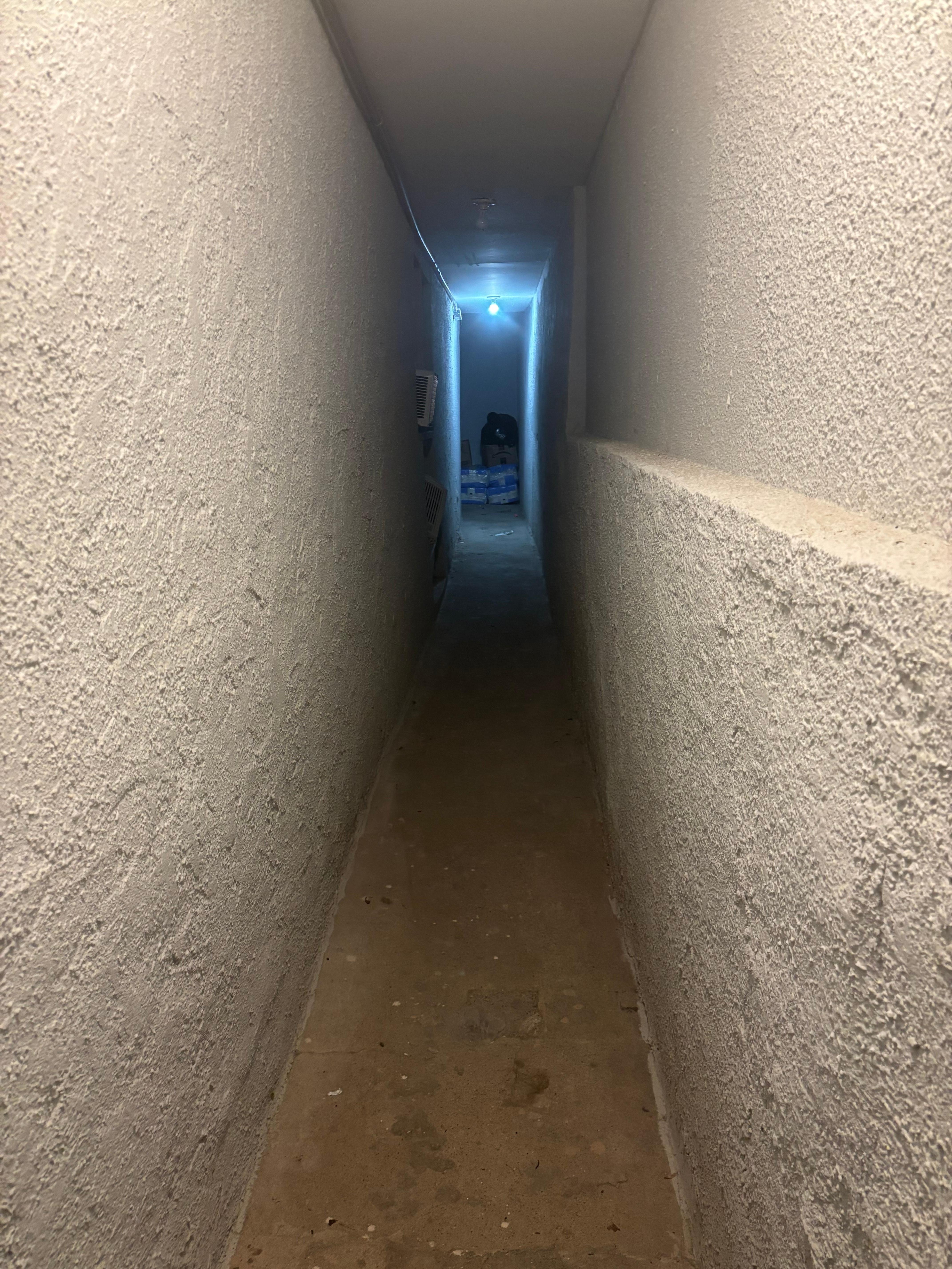 Creepy basement hallway. Cannot upload video of entire apartment.
