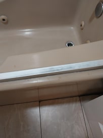 Crud on floor, questionable tub