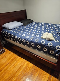 Two pillows one pillowcase. Community towel. Bed is broken underneath.