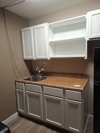 Why is there a cord hanging from the ceiling to turn the light on?