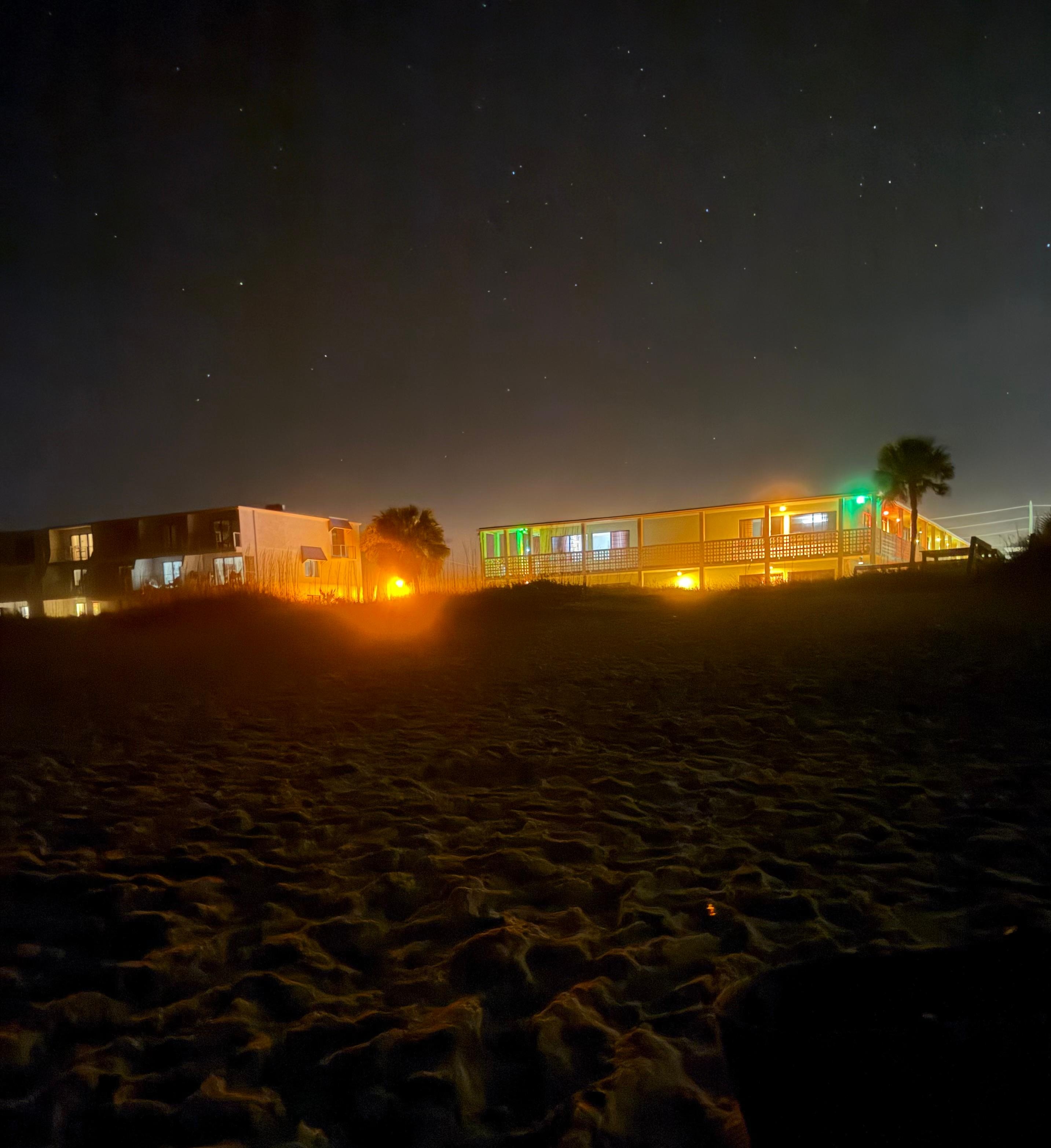 The motel from the beach at night 