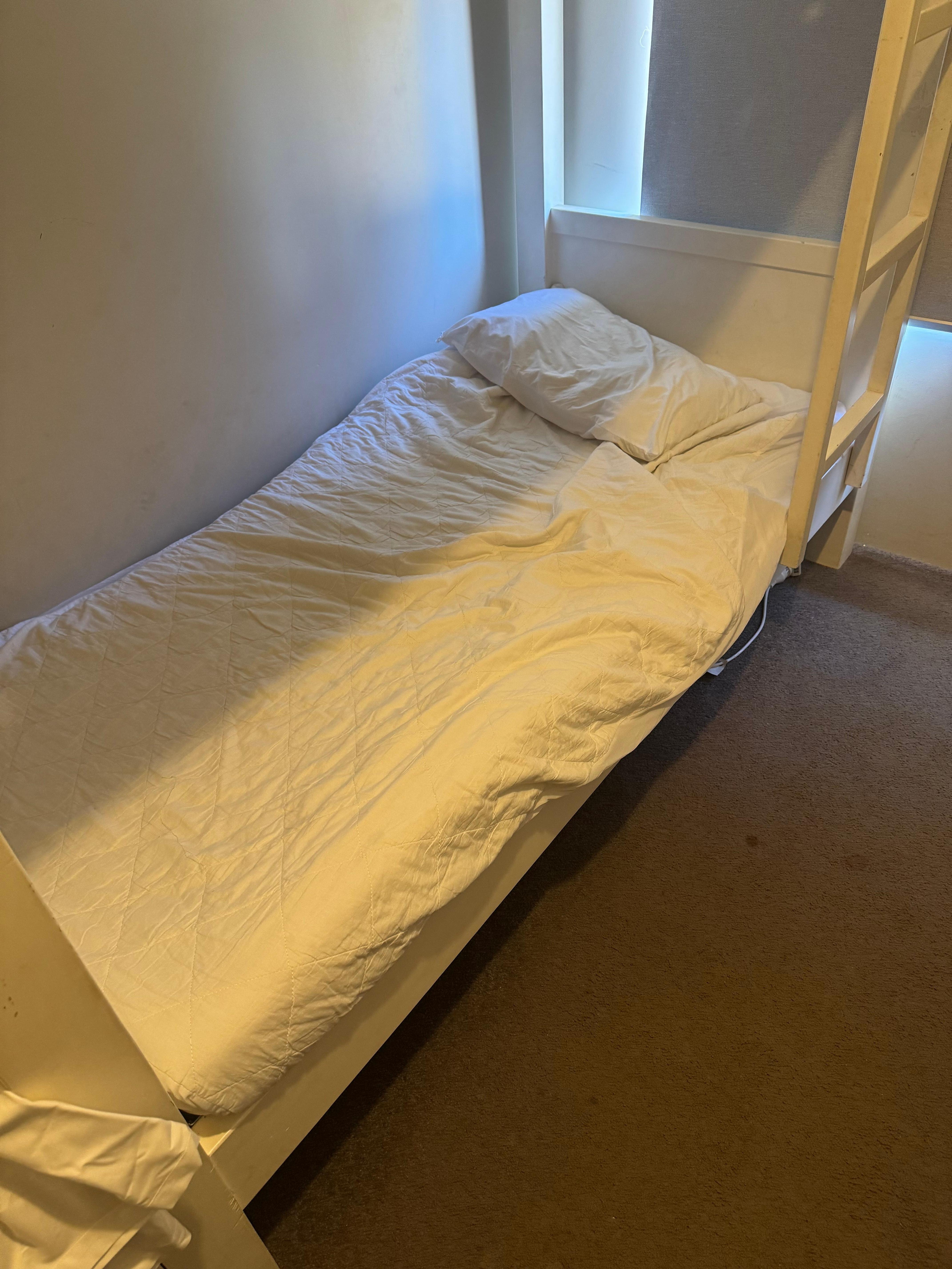 bunk beds were presented like this with stained mattress protectors. 