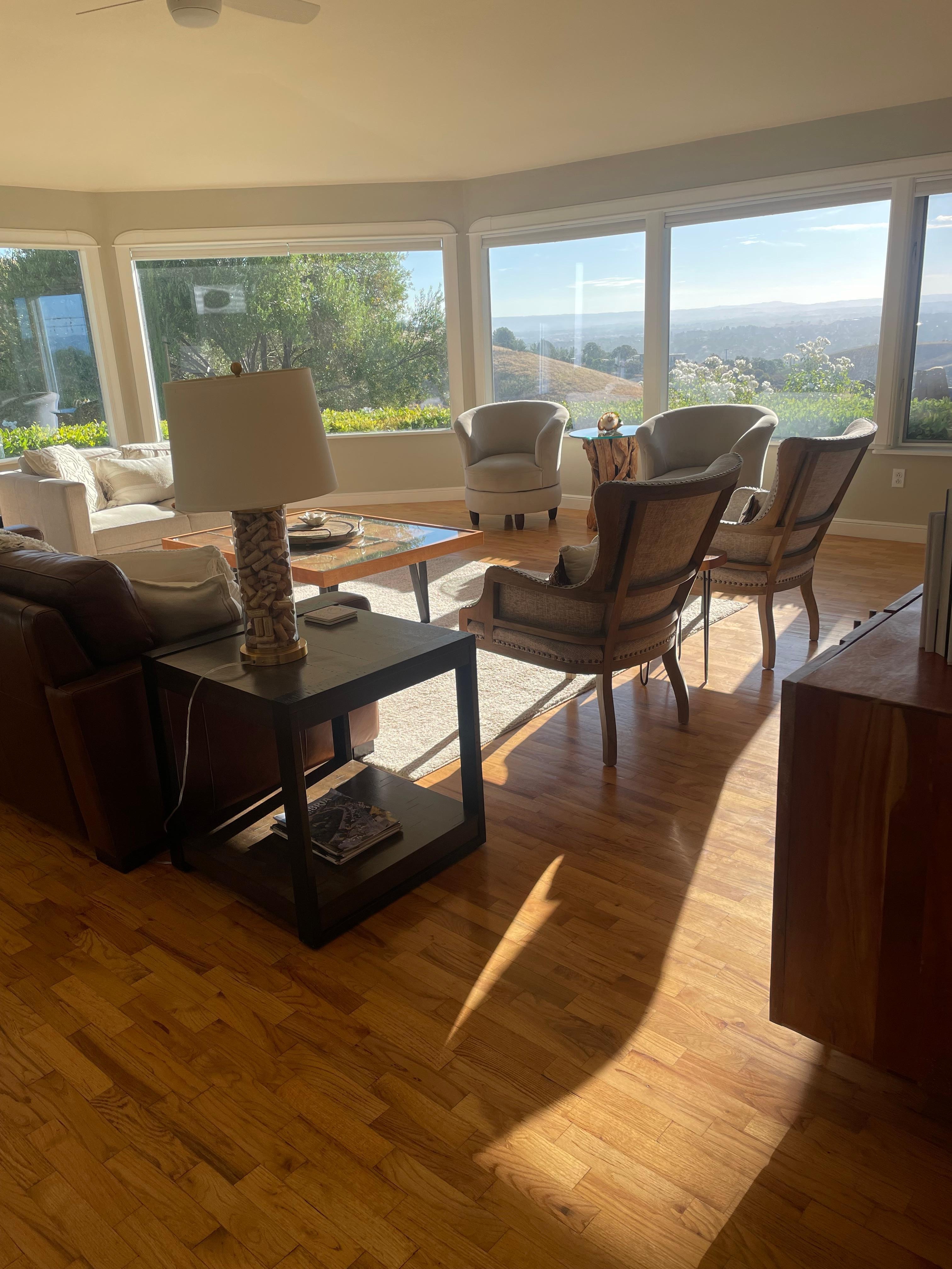 View into den of the beautiful view out the panoramic windows. 