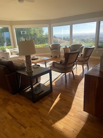 View into den of the beautiful view out the panoramic windows.
