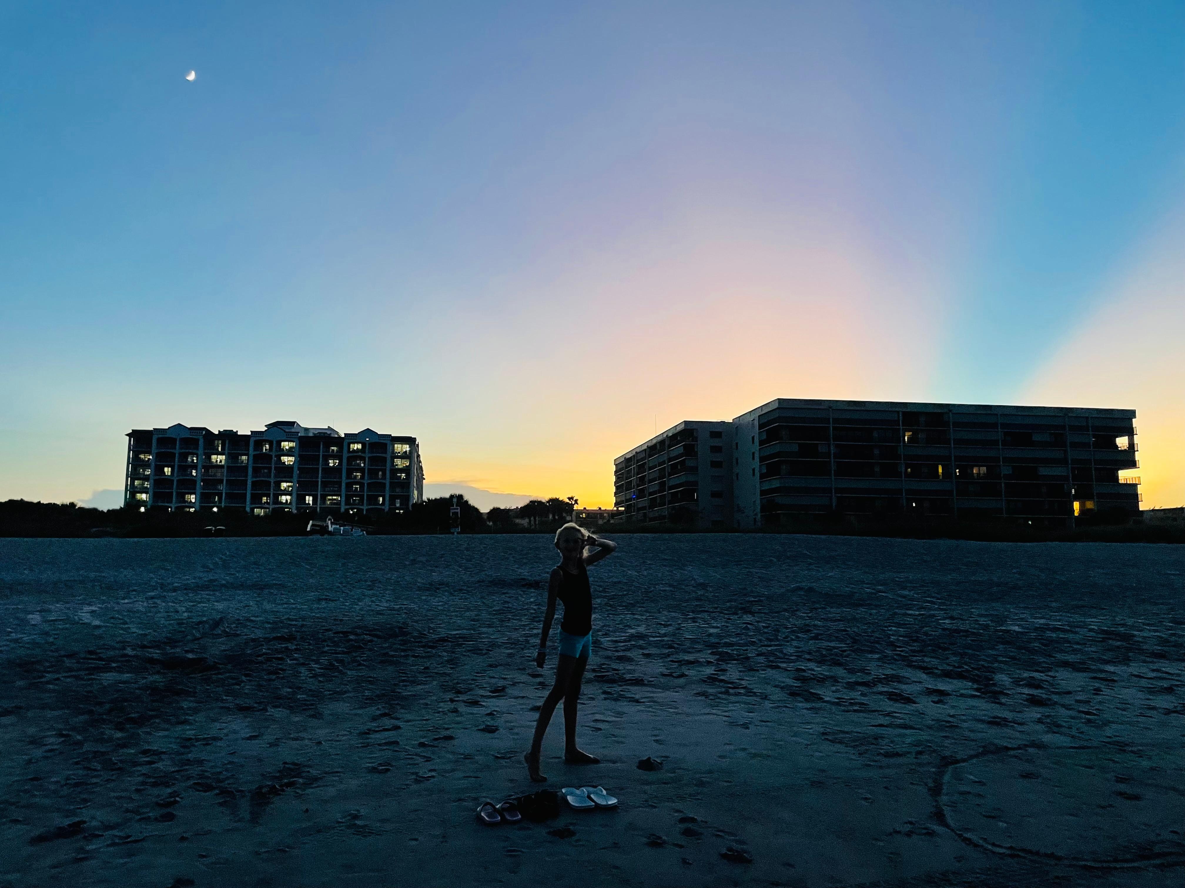 View of the resort of the left at sunset from the beach.